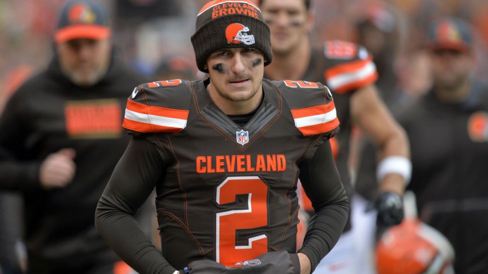 Then-Cleveland Browns quarterback Johnny Manziel walks off the field at halftime during a game against the Cincinnati Bengals on Dec. 6, 2015. (David Richard / Associated Press)