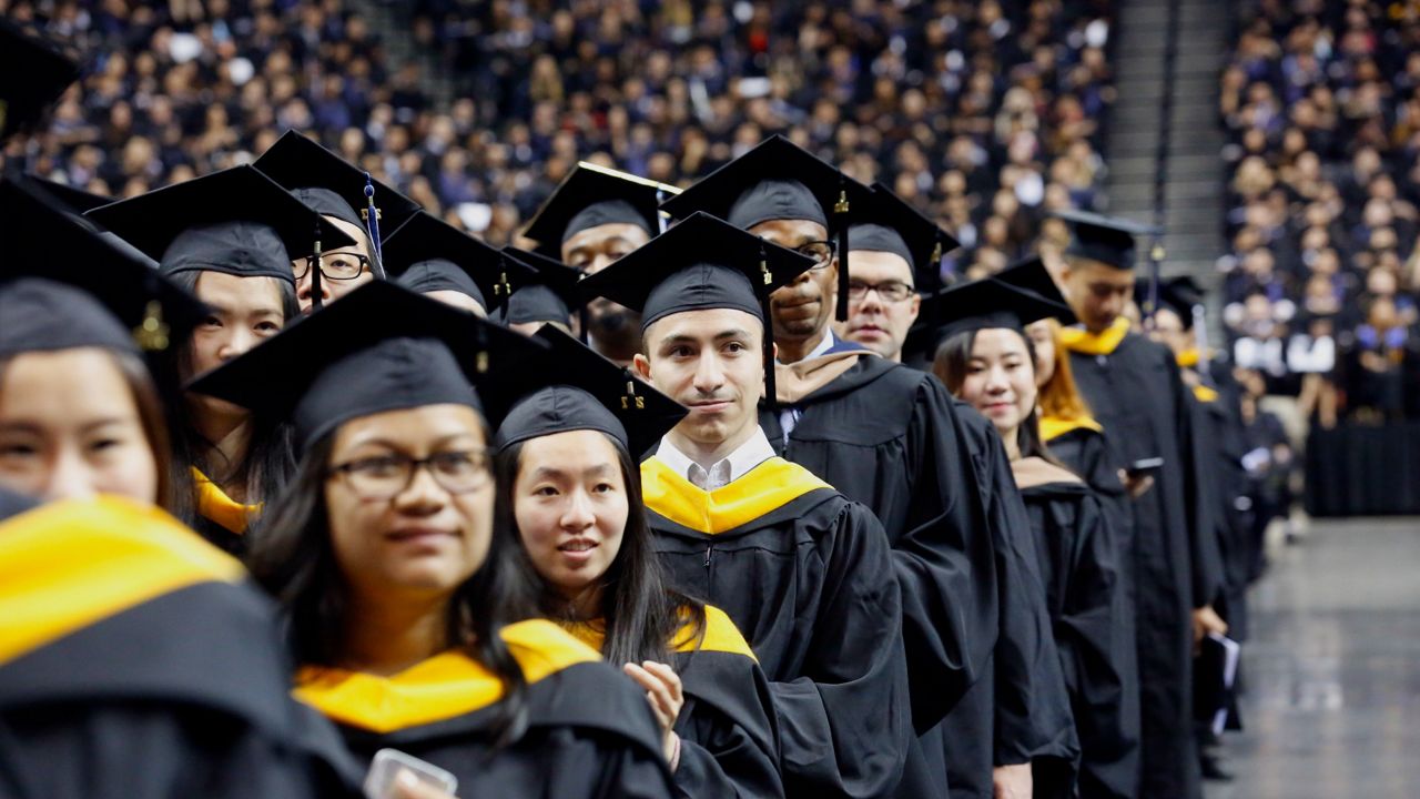 Graduates of Baruch College participate in a commencement program at Barclays Center in Brooklyn, New York on Monday, June 5, 2017. (AP Photo/Bebeto Matthews)