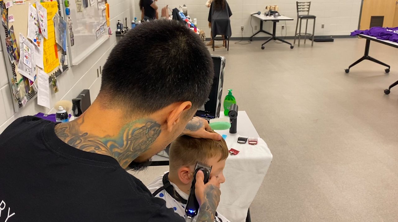 150 students get free haircuts before school in West Allis