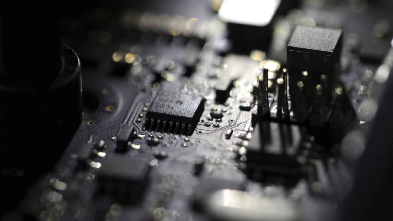 FILE - This Feb 23, 2019, file photo shows the inside of a computer in Jersey City, N.J. (AP Photo/Jenny Kane, File)