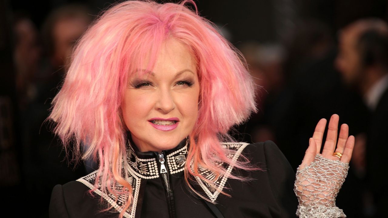  In this April 3, 2016 file photo, actress and singer Cyndi Lauper poses for photographers upon arrival at the Olivier Awards in London.
