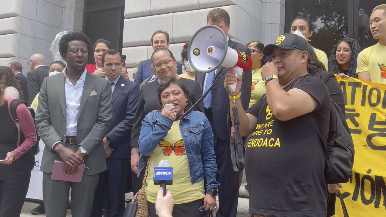 Karina Ruiz de Diaz talks immigration on the steps of the Fifth Circuit Court of Appeals. (Spectrum News 1/Kimberly Reeves)