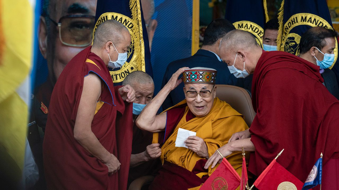 Tibetan spiritual leader the Dalai Lama wears a traditional Himachali cap as he arrives at the Tsuglakhang temple in Dharamshala, India, Saturday, Nov. 19, 2022. The Tibetan leader received a medal from the India based Gandhi Mandela Foundation. (AP Photo/Ashwini Bhatia)