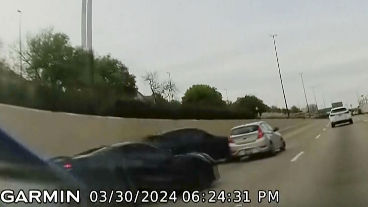 In this screen grab taken from dash camera video provided by Bill Nabors, two speeding sports cars, left and second from left, cause a chain-reaction crash on the North Central Expressway, in Dallas, Saturday, March 30, 2024. (Bill Nabors via AP)