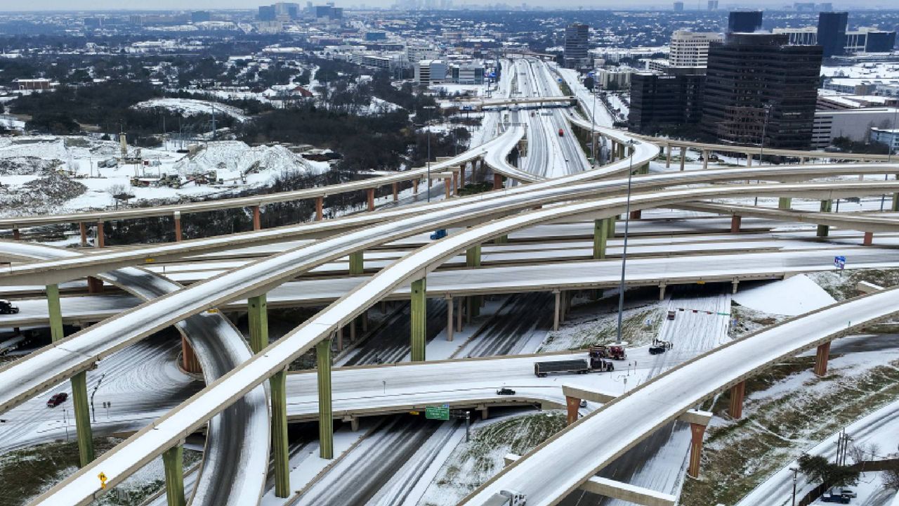  An icy mix covers the High Five Interchange at US 75 and I-635 on Tuesday, Jan. 31, 2023, in Dallas. Dallas and other parts of North Texas are under a winter storm warning that has been extended through Thursday. (Smiley N. Pool/The Dallas Morning News via AP)
