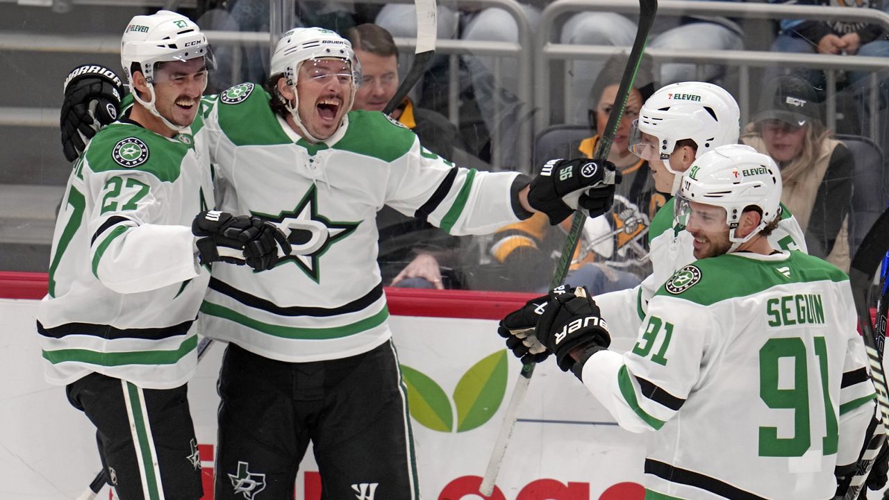 Dallas Stars' Mason Marchment (27) celebrates after his goal with Matt Duchene (95), Nils Lundkvist, back right, and Tyler Seguin (91) during the first period of an NHL hockey game against the Pittsburgh Penguins in Pittsburgh, Monday, Nov. 11, 2024. (AP Photo/Gene J. Puskar)