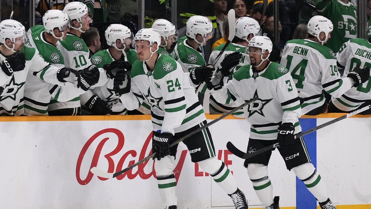 Dallas Stars center Roope Hintz (24) celebrates his goal with teammates during the second period of an NHL hockey game against the Nashville Predators, Thursday, Oct. 10, 2024, in Nashville, Tenn. (AP Photo/George Walker IV)