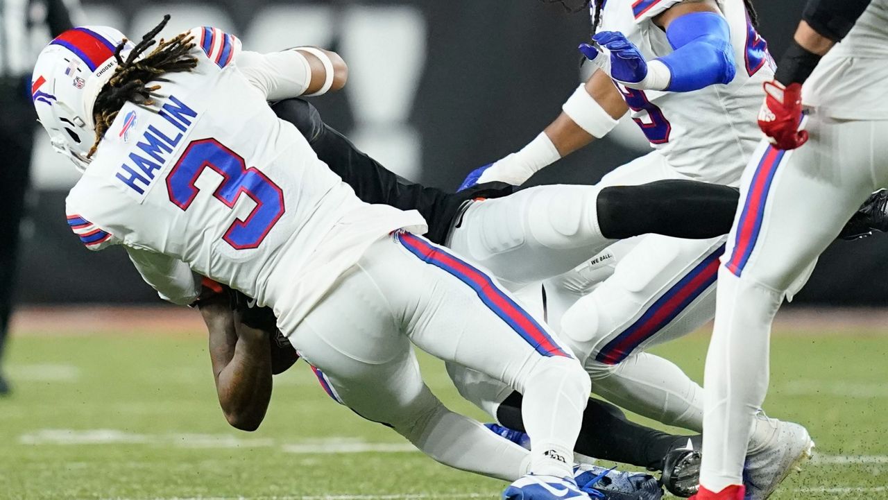 Bills safety Damar Hamlin breathing on his own, joins team via