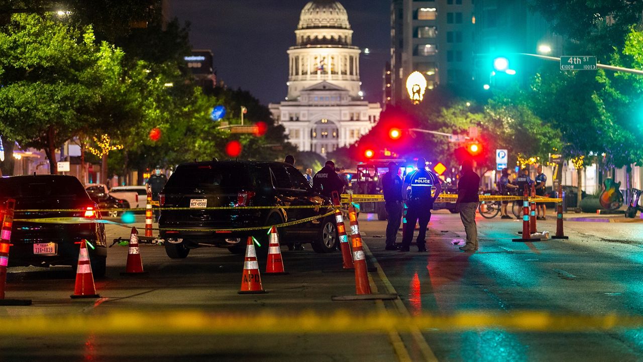 Austin police investigate a homicide shooting that occurred at a demonstration against police violence in downtown Austin, Texas, July 25, 2020. A U.S. Army sergeant was convicted of murder for fatally shooting an armed protester in 2020 during nationwide protests against police violence and racial injustice, a Texas jury ruled Friday, April 7, 2023. Sgt. Daniel Perry was working for a ride-sharing company in July 2020 when he turned onto a street and into a large crowd of demonstrators in downtown Austin. (Stephen Spillman/Austin American-Statesman via AP, File)