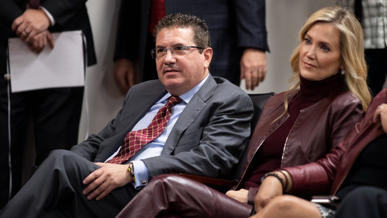 Dan Snyder, left, and his wife, Tanya Snyder, listen to Washington head coach Ron Rivera during a news conference on Jan. 2, 2020, in Ashburn, Va. (AP Photo/Alex Brandon, File)