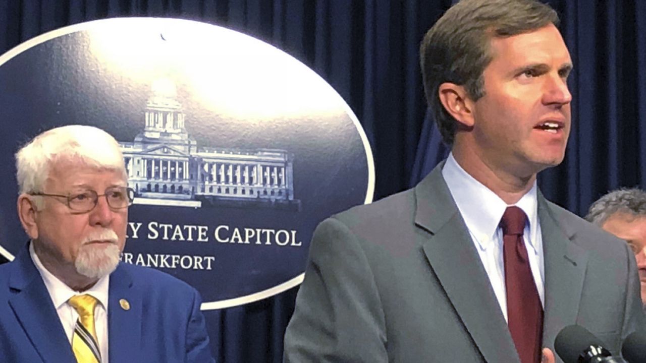 Kentucky Gov. Andy Beshear, right, speaks during a news conference, Feb. 18, 2020, in Frankfort, Ky. as Republican state Rep. Danny Bentley listens. (AP Photo/Bruce Schreiner, file)