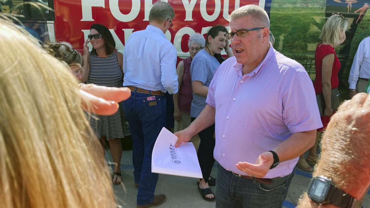 Republican candidate for Illinois governor Darren Bailey speaks to voters during a campaign stop in Athens, Ill., June 14, 2022. Bailey is seeking the Republican nomination to face Democratic Gov. J.B. Pritzker in November. (AP Photo/John O'Connor)