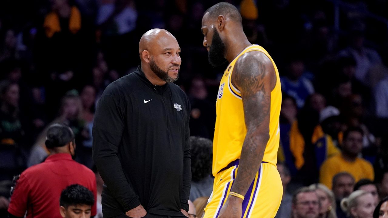 Los Angeles Lakers forward LeBron James (23) shoots as Denver Nuggets forward Peyton Watson (8) and center Nikola Jokic defend during the first half in Game 4 of an NBA basketball first-round playoff series Saturday, April 27, 2024, in Los Angeles. (AP Photo/Mark J. Terrill)