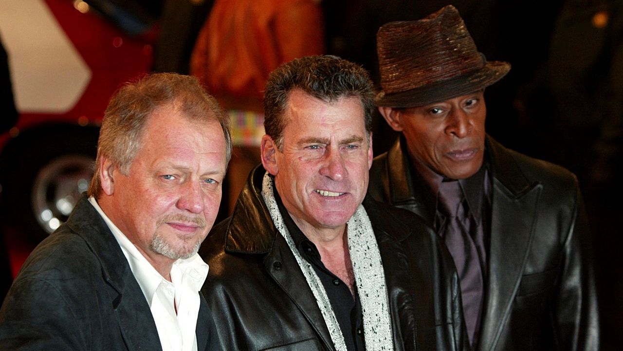 David Soul, left, Paul Michael Glaser and Antonio Fargas, right, stars of the original 1970’s “Starsky and Hutch” television series, arrive at the British premiere of the new movie of the same name based on the TV series, in London on March 11, 2004. (AP Photo/John D McHugh)