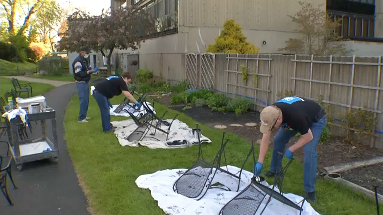 people painting furniture