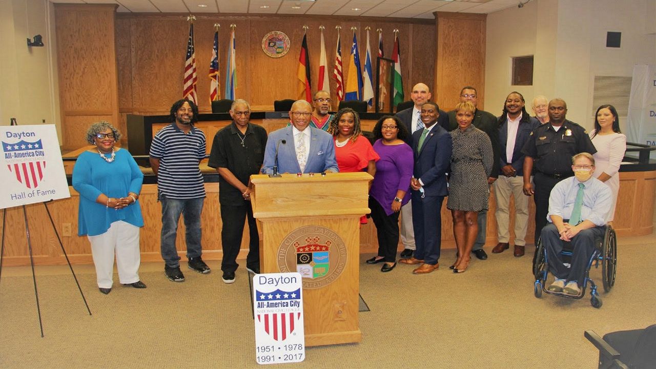 Some members of the working groups that oversaw the Dayton police reform process pose for a photo in City Commission chambers. The city had just been named to the National Civic League Hall of Fame. (Photo courtesy of City of Dayton)
