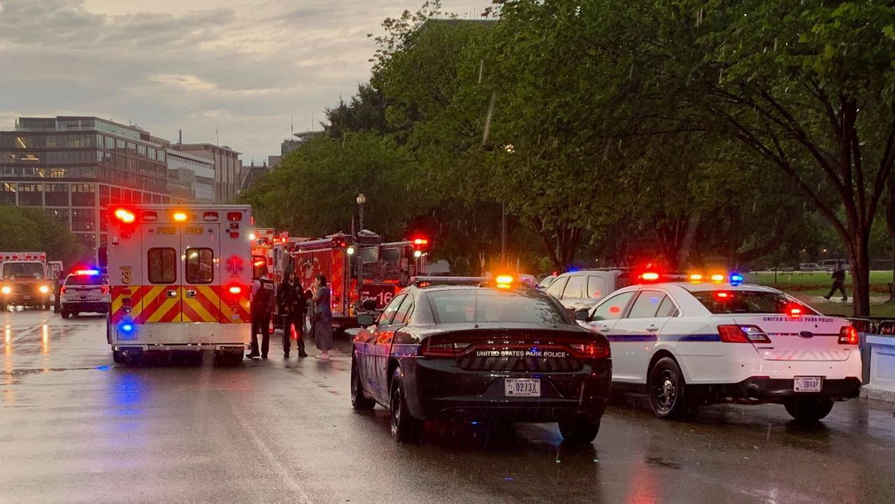 Emergency responders shut down the street near Lafayette Park on Thursday, Aug. 4, 2022. Four people were critically injured by a lightning strike at the park near the White House. (DC Fire and EMS via Twitter)
