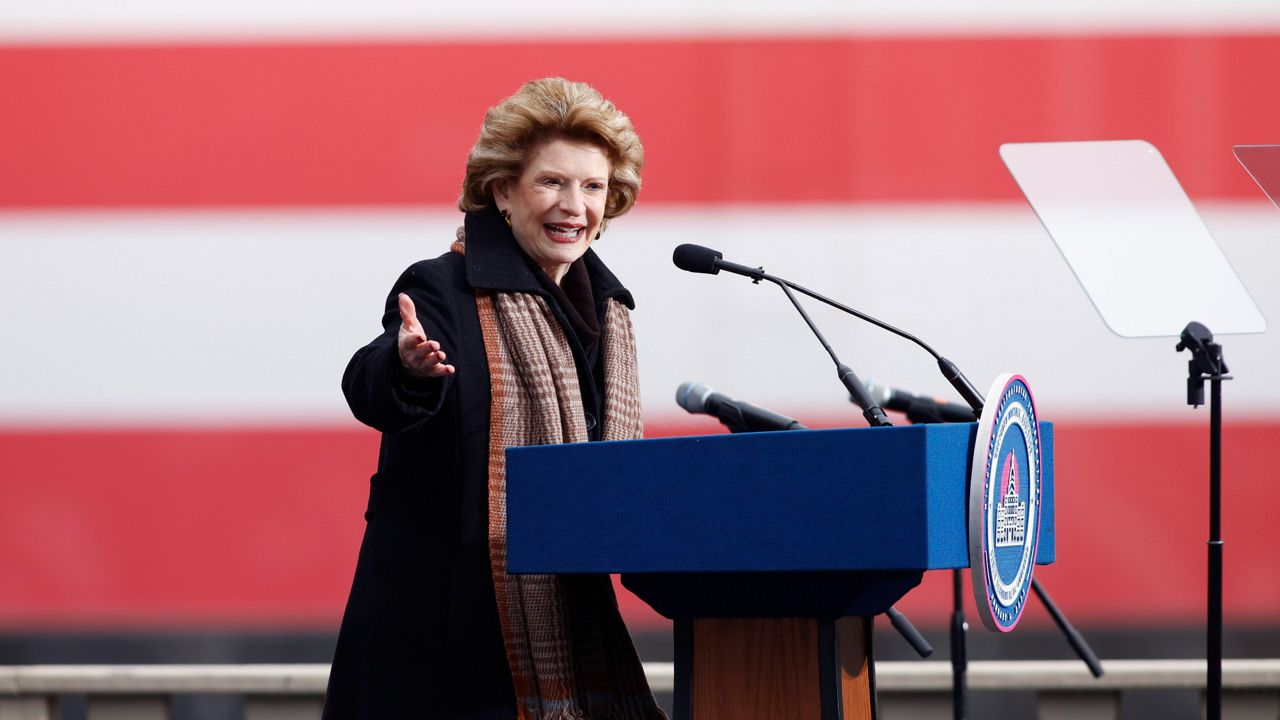 Sen. Debbie Stabenow addresses the crowd during inauguration ceremonies Sunday outside the state Capitol in Lansing, Mich. (AP Photo/Al Goldis)