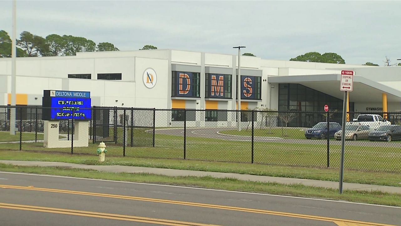 Two Volusia County parents were arrested Tuesday after allegedly attacking a school resource deputy at Deltona Middle School. (Spectrum News/Arnie Girard)