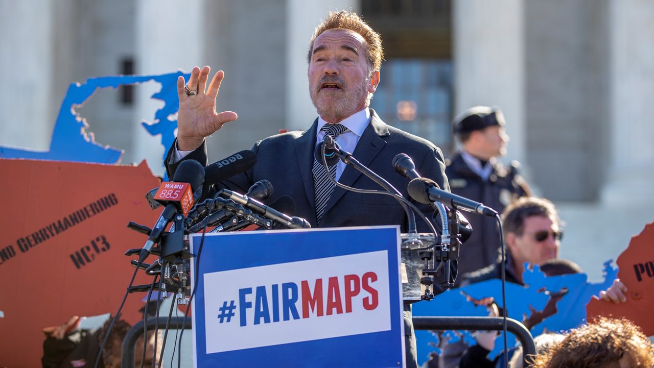 In this March 26, 2019, file photo former California Gov. Arnold Schwarzenegger speaks at a rally calling for "Fair Maps" at the Supreme Court in Washington. In California its last Republican governor, Arnold Schwarzenegger, passed a 2008 ballot measure creating a nonpartisan commission. (AP/Carolyn Kaster, File)