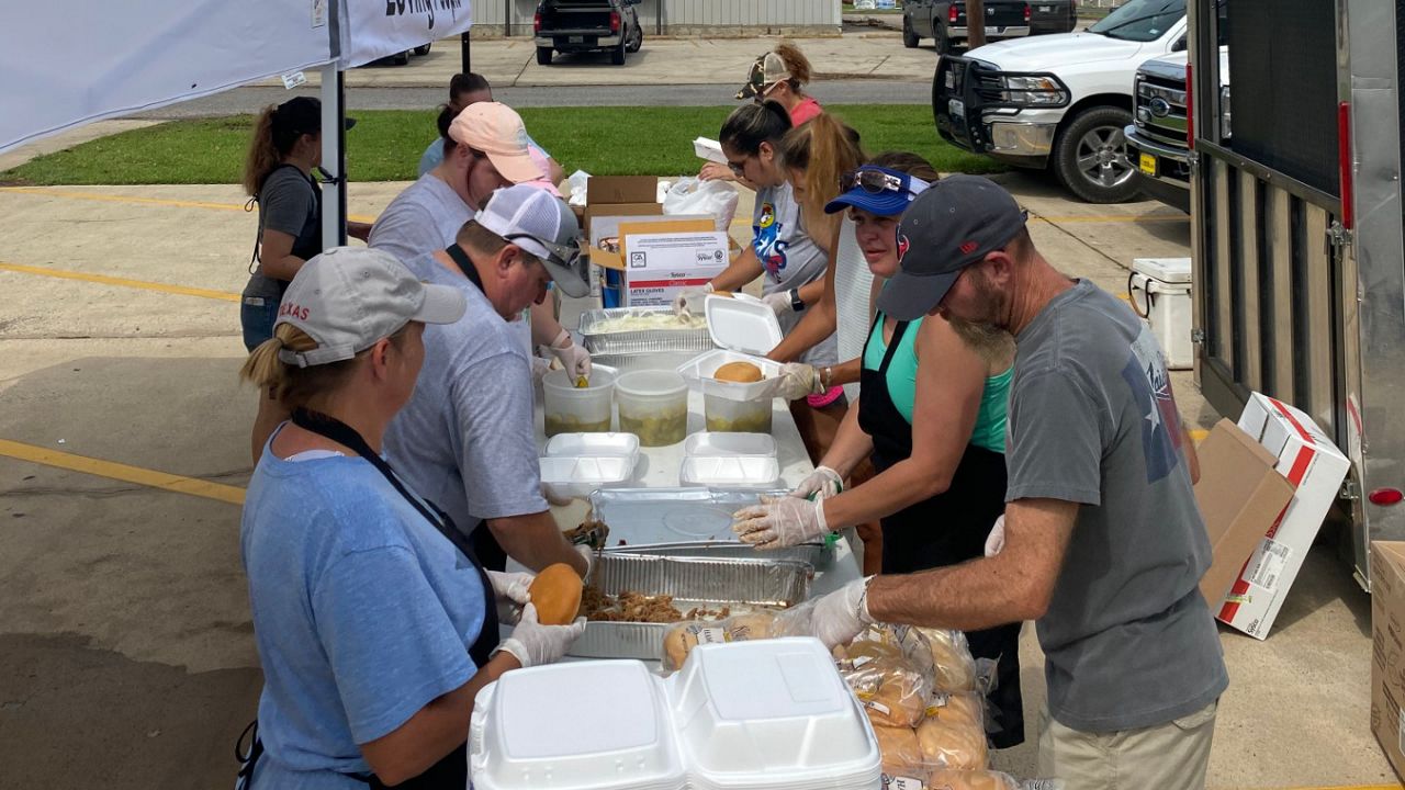 Volunteers at The Pentecostal Church in DeQuincy, La., prepare food for a drive-through pickup.