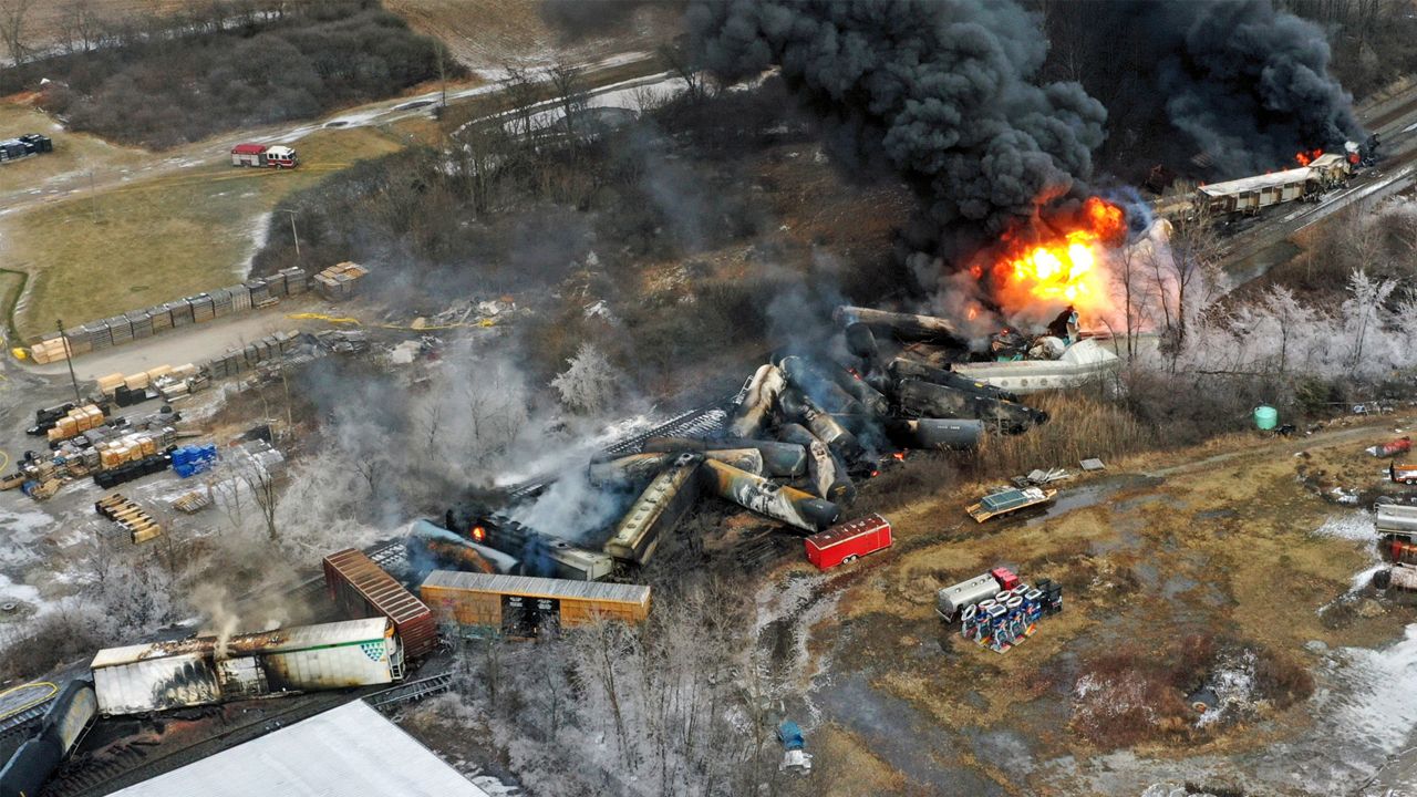 In this photo taken with a drone, portions of a Norfolk Southern freight train that derailed the previous night in East Palestine, Ohio, remain on fire at mid-day, Feb. 4, 2023. (AP Photo/Gene J. Puskar, File)