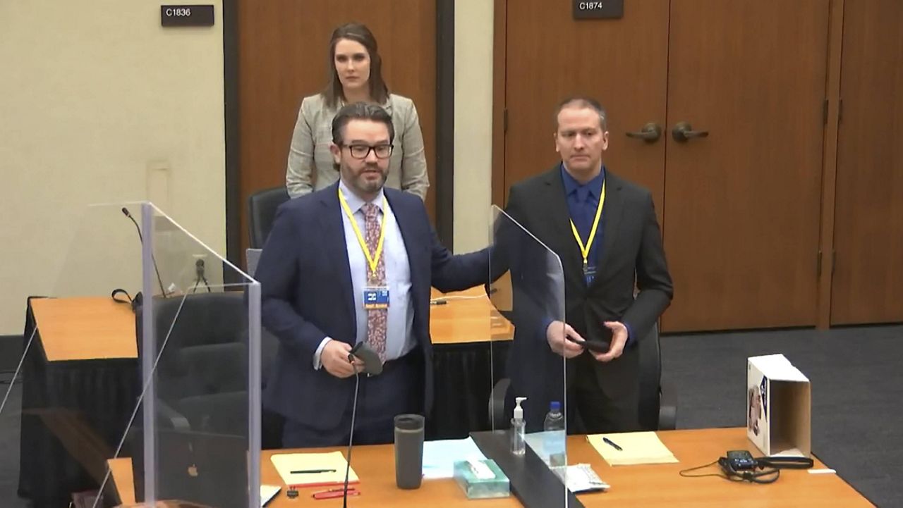 Defense attorney Eric Nelson (left) and Derek Chauvin (right) introduce themselves to potential jurors Tuesday. (Court TV, via AP, Pool)