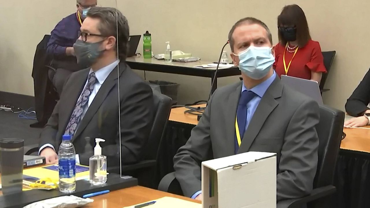 Defense attorney Eric Nelson (left) and former Minneapolis police officer Derek Chauvin listen as the judge presides over pre-trial motions Monday. (Court TV via AP, Pool)