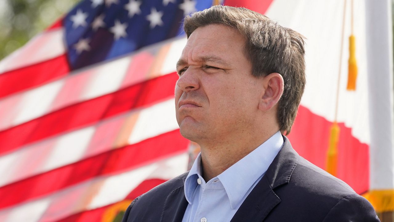 Florida Gov. Ron DeSantis listens during a news conference, Tuesday, Aug. 3, 2021, near the Shark Valley Visitor Center in Miami. (AP Photo/Wilfredo Lee)