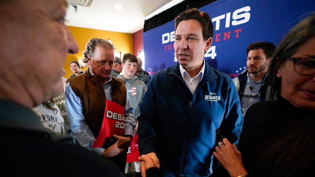 Republican presidential candidate Florida Gov. Ron DeSantis talks with audience members during a meet and greet, Friday, Nov. 3, 2023, in Denison, Iowa. (AP Photo/Charlie Neibergall, File)