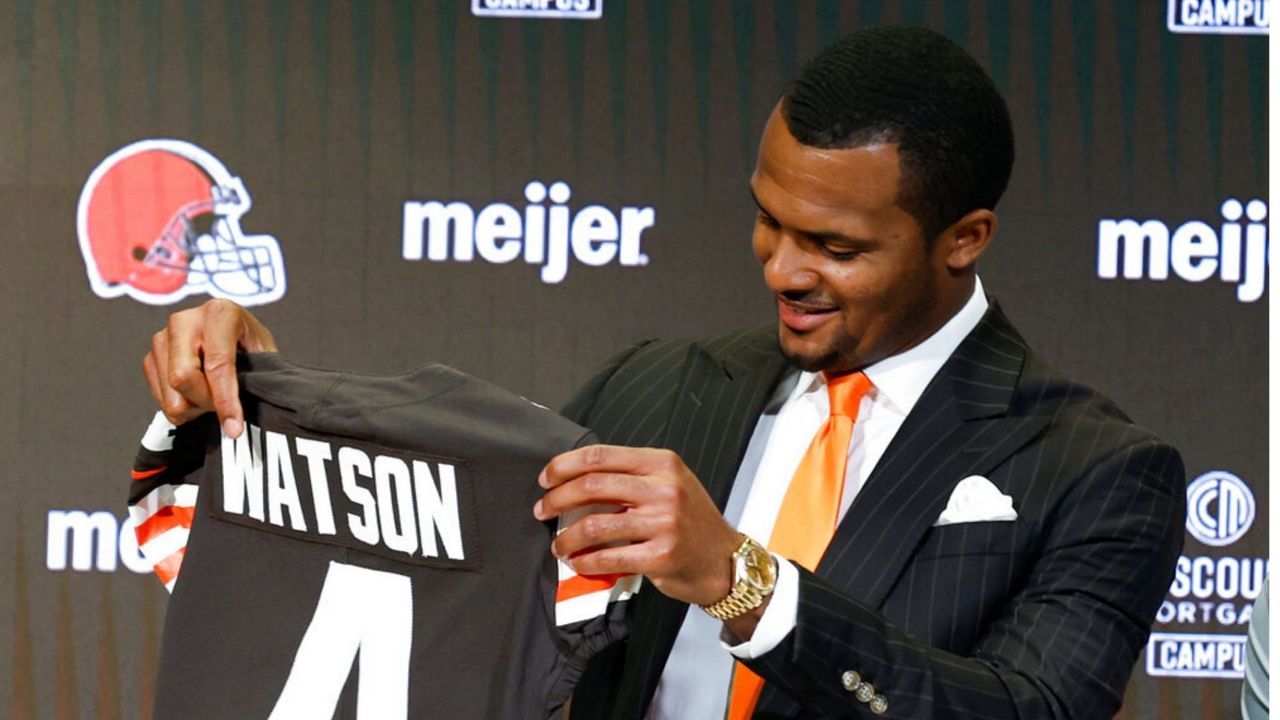 Deshaun Watson spoke during a news conference at the NFL football team's training facility as general manager Andrew Berry, left, and head coach Kevin Stefanski listen, Friday, March 25, 2022, in Berea, Ohio. (AP Photo/Ron Schwane)