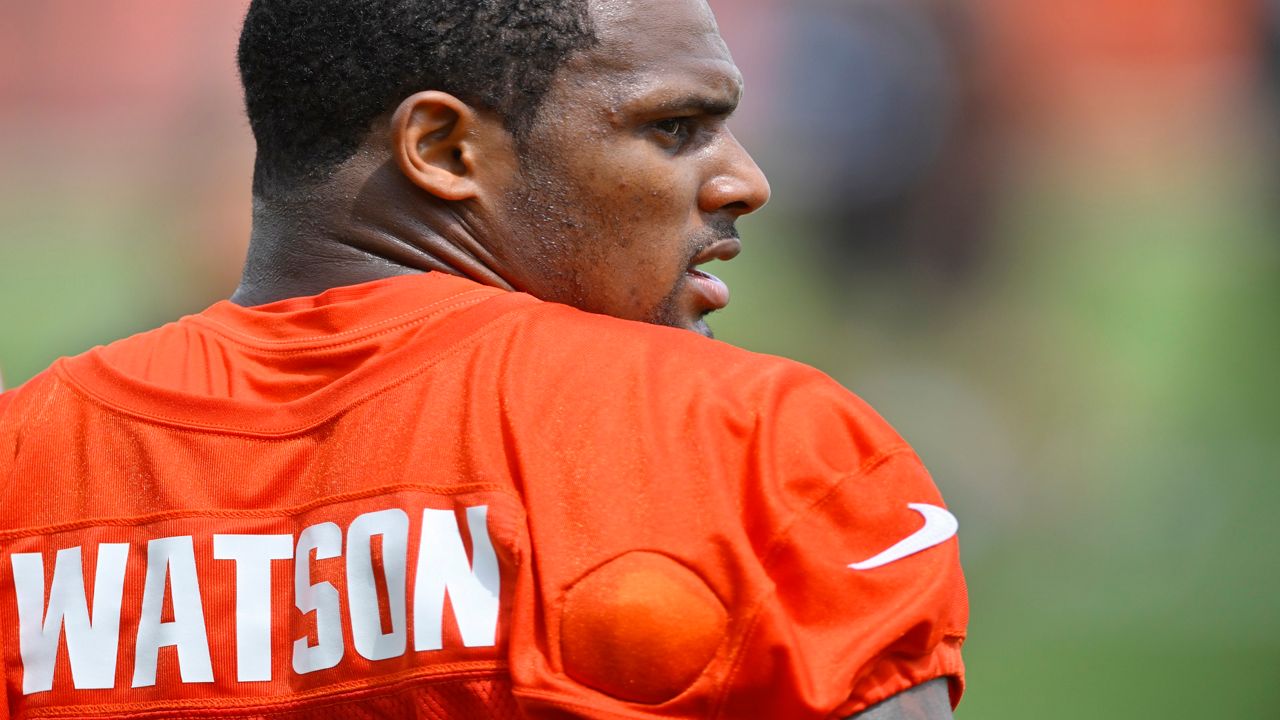 Cleveland Browns quarterback Deshaun Watson stands on the field during an NFL football practice at the team's training facility Wednesday, June 1, 2022, in Berea, Ohio. (AP Photo/David Richard