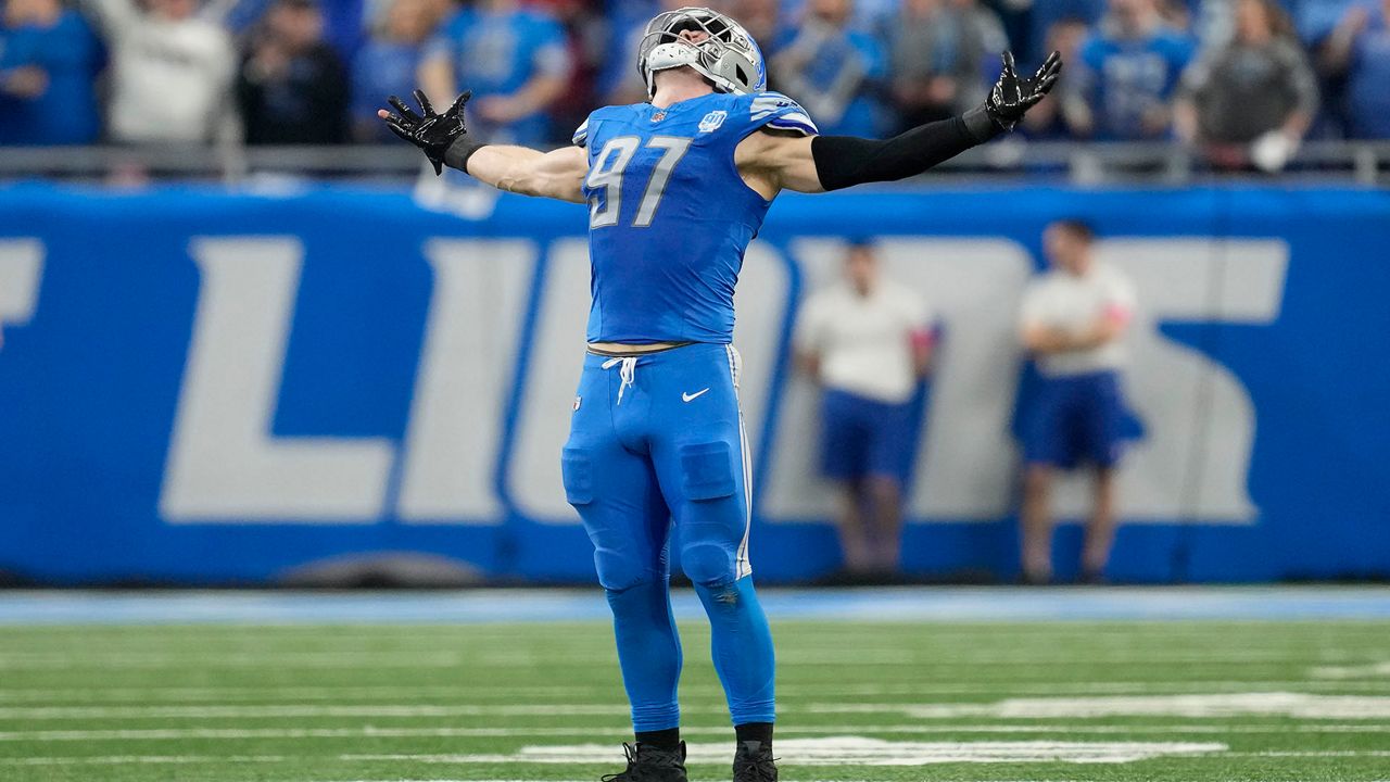 Detroit Lions defensive end Aidan Hutchinson reacts after a play against the Tampa Bay Buccaneers during the second half of an NFL football NFC divisional playoff game, Sunday, Jan. 21, 2024, in Detroit. (AP Photo/Paul Sancya)