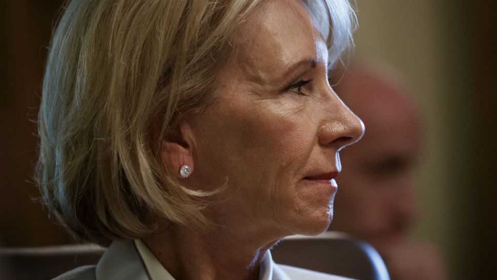 Secretary of Education Betsy DeVos listens as President Donald Trump speaks during a cabinet meeting at the White House, Thursday, June 21, 2018, in Washington. (AP Photo/Evan Vucci)