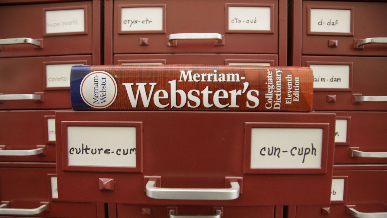 A Merriam-Webster dictionary sits atop their citation files at the dictionary publisher's offices on Dec. 9, 2014, in Springfield, Mass. (AP Photo/Stephan Savoia, File)