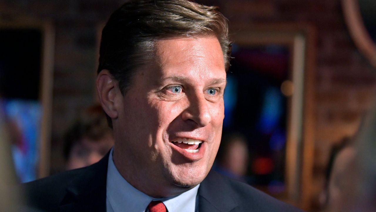 Massachusetts Republican gubernatorial candidate Geoff Diehl speaks to reporters Tuesday at his primary night victory party in Weymouth, Mass. (AP Photo/Josh Reynolds)