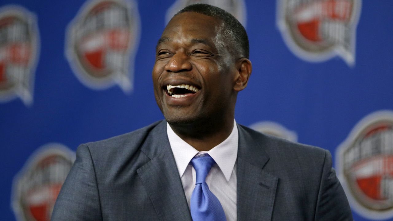 Former NBA basketball player Dikembe Mutombo laughs during a news conference in 2015. (AP Photo/Julio Cortez, File)