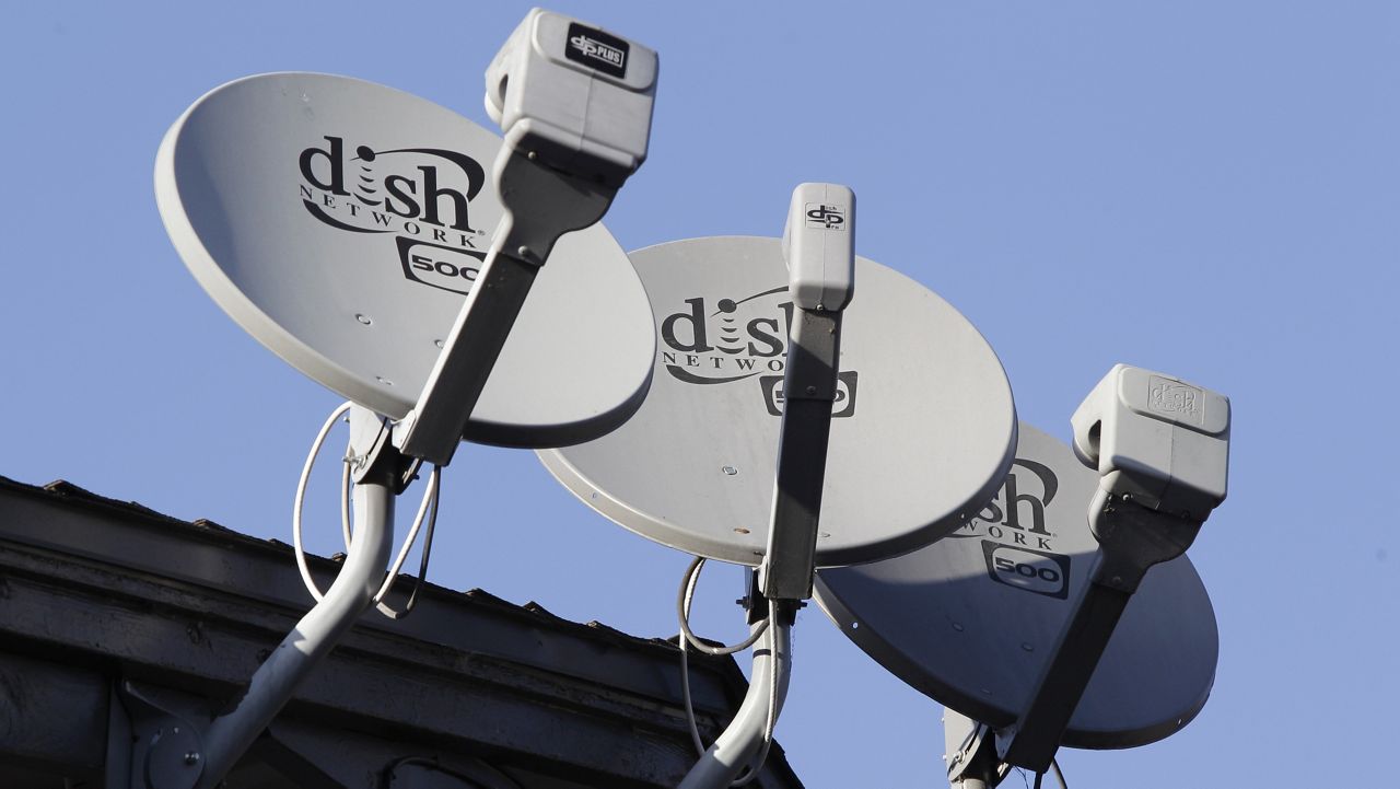 In this Feb. 23, 2011, file photo, Dish Network satellite dishes are shown at an apartment complex in Palo Alto, Calif. (AP Photo/Paul Sakuma, File)