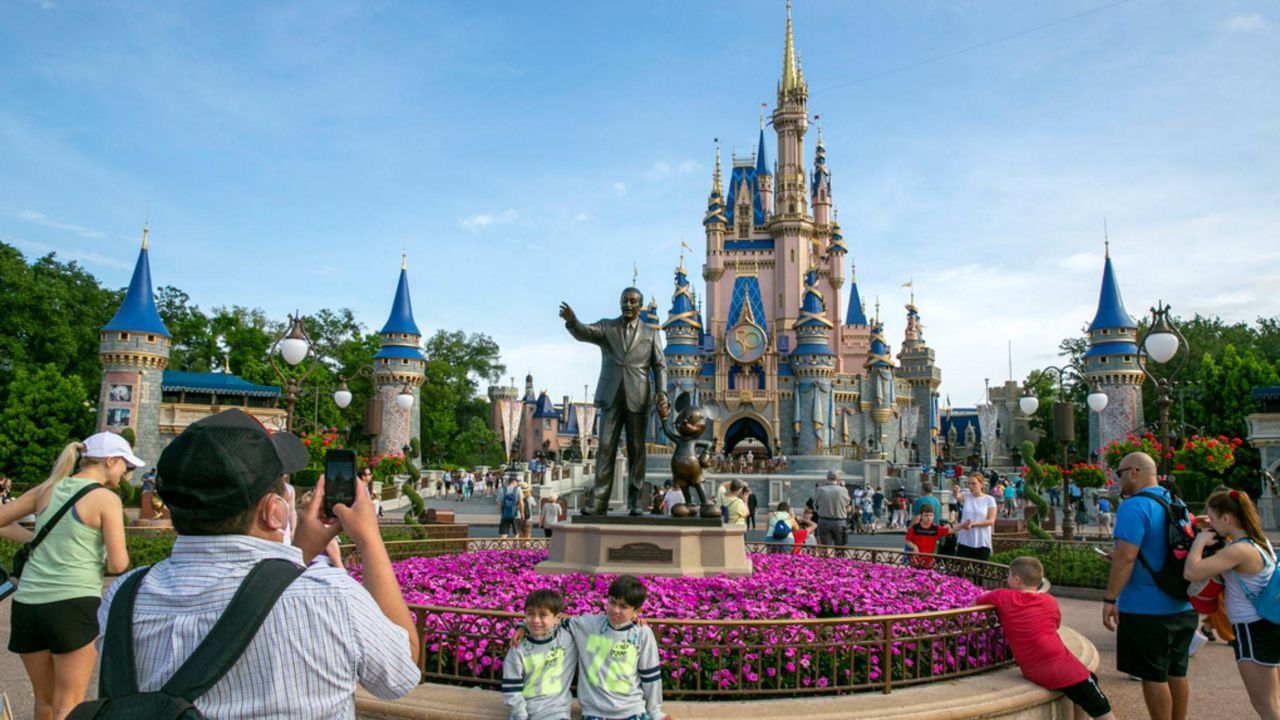 People visit the Magic Kingdom Park at Walt Disney World Resort in Lake Buena Vista, Fla., April 18, 2022. (AP Photo/Ted Shaffrey, File)