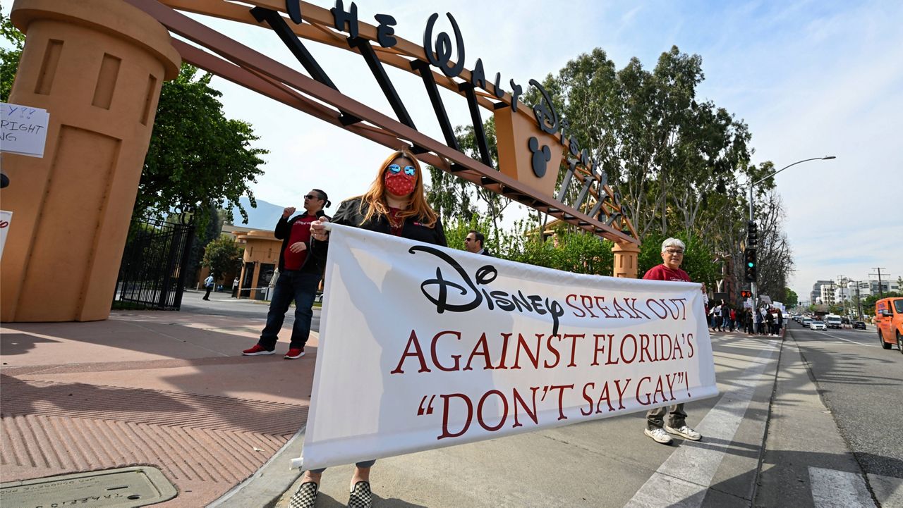 Protesters gather at the Walt Disney Co. in Burbank, Calif., spearheaded by advocates from AIDS Healthcare Foundation, on Thursday, March 03, 2022 in Burbank, Calif. The advocates targeted Disney in two near simultaneous rallies in Orlando and Burbank to urge the company to publicly speak out against Florida’s so-called "Don't Say Gay” bill. (Dan Steinberg/AP Images for AIDS Healthcare Foundation, File)