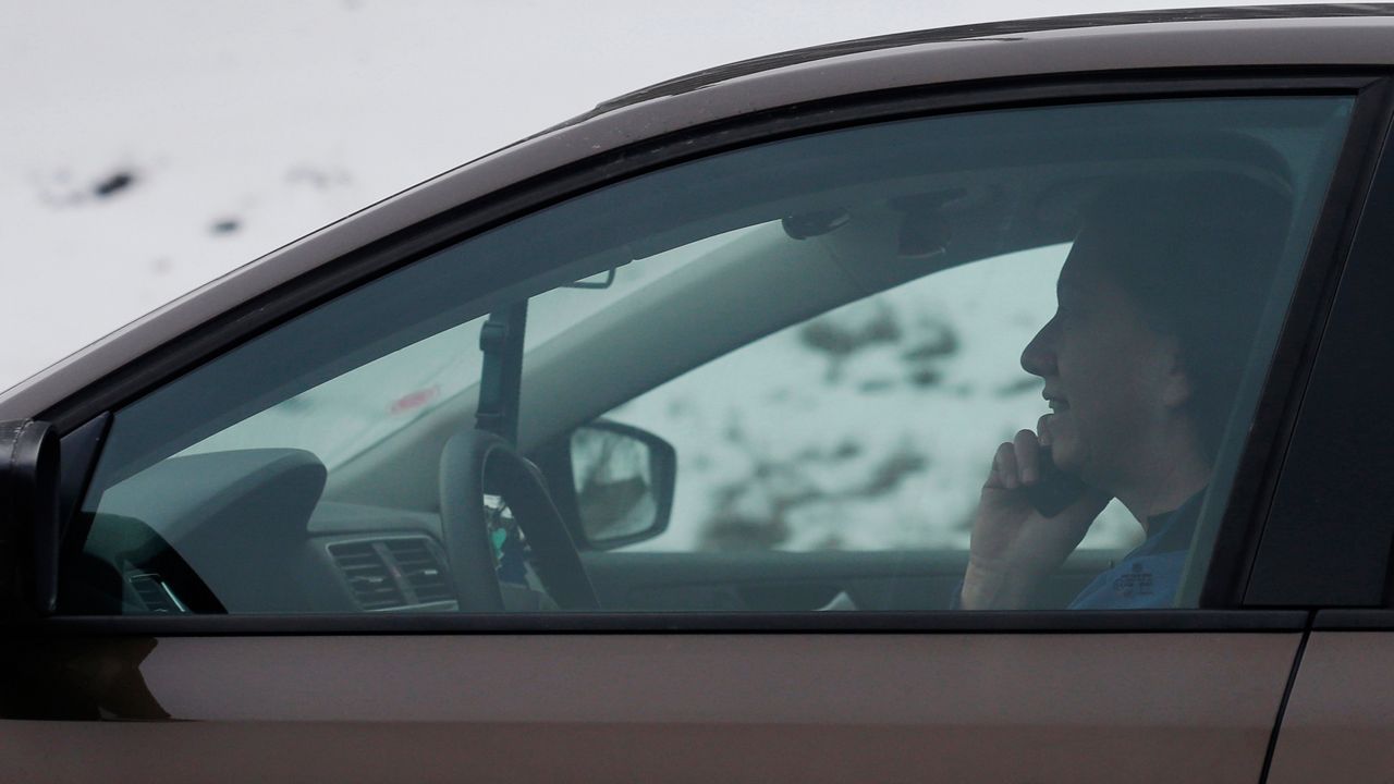 Data shows that Ohio drivers are spending a little less time on their phones while driving since the state's new distracted driving law went into effect on April 4. (AP Photo/Nam Y. Huh)
