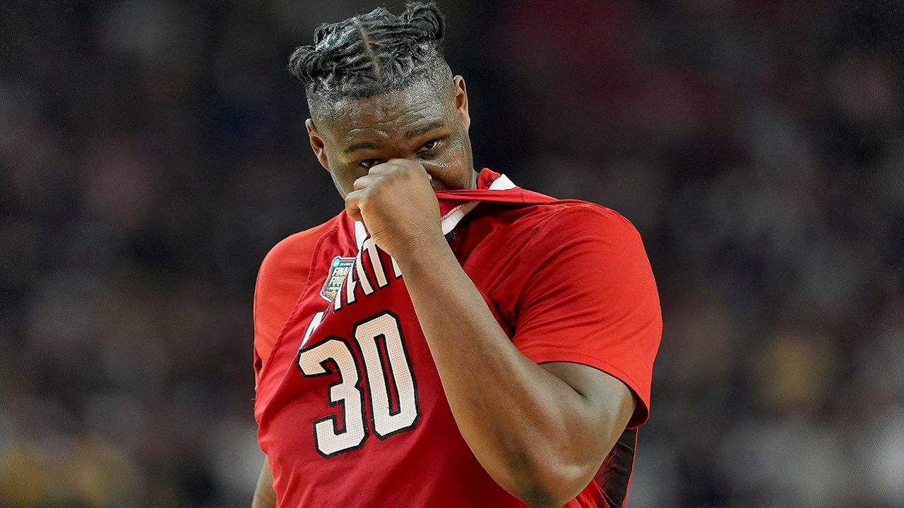 N.C. State forward DJ Burns Jr. (30) wipes his face after their loss against Purdue during a NCAA college basketball game at the Final Four, Saturday, April 6, 2024, in Glendale, Ariz. (AP Photo/David J. Phillip)