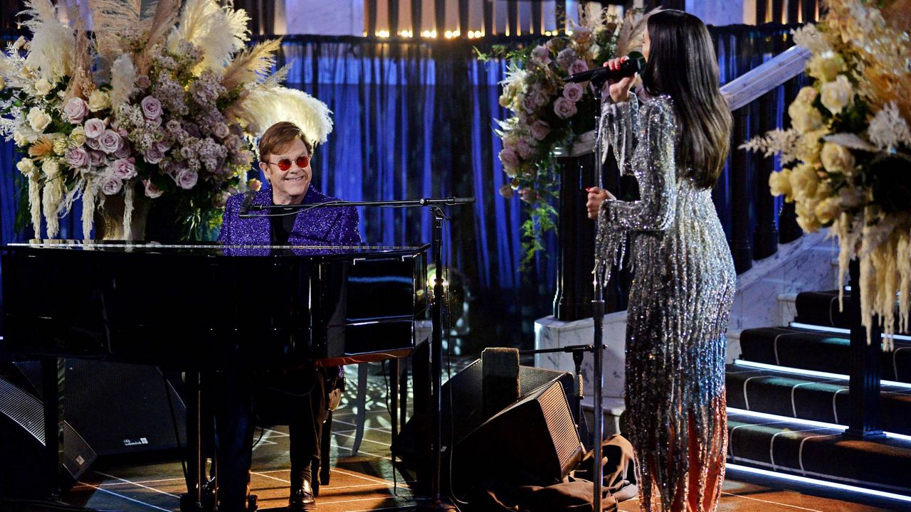 In this photo released on April 25, Sir Elton John and Dua Lipa perform during the 29th Annual Elton John AIDS Foundation Academy Awards Viewing Party on April 25, 2021. (Photo by David M. Benett/Getty Images for the Elton John AIDS Foundation)