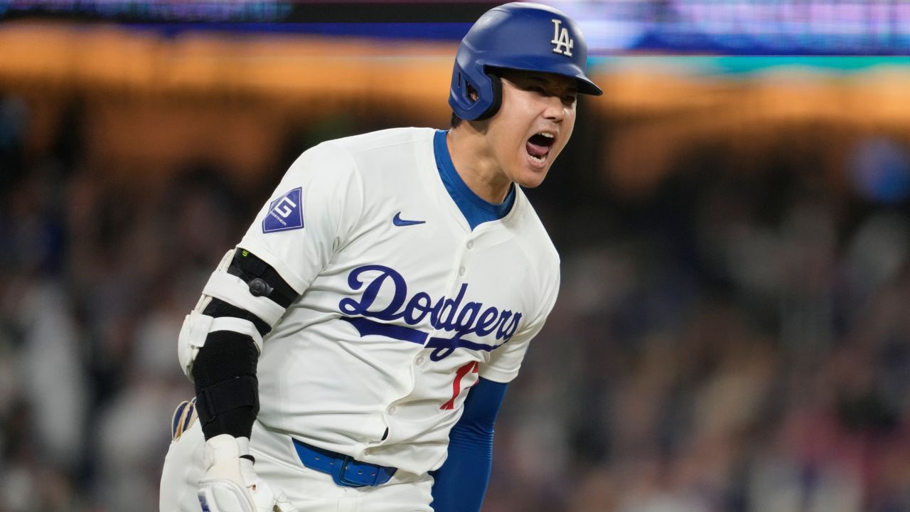 Los Angeles Dodgers designated hitter Shohei Ohtani reacts as he singles during the sixth inning of a baseball game against the San Diego Padres in LA on Wednesday. (AP Photo/Ashley Landis)