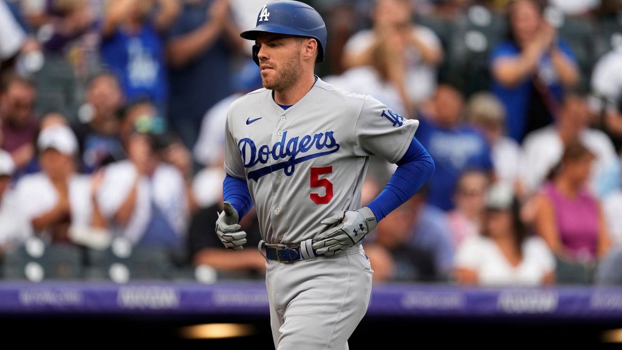 Los Angeles Dodgers' Freddie Freeman runs the bases after hitting a solo home run off Colorado Rockies starting pitcher German Marquez during the first inning of a baseball game, June 29, 2022, in Denver. (AP Photo/David Zalubowski)