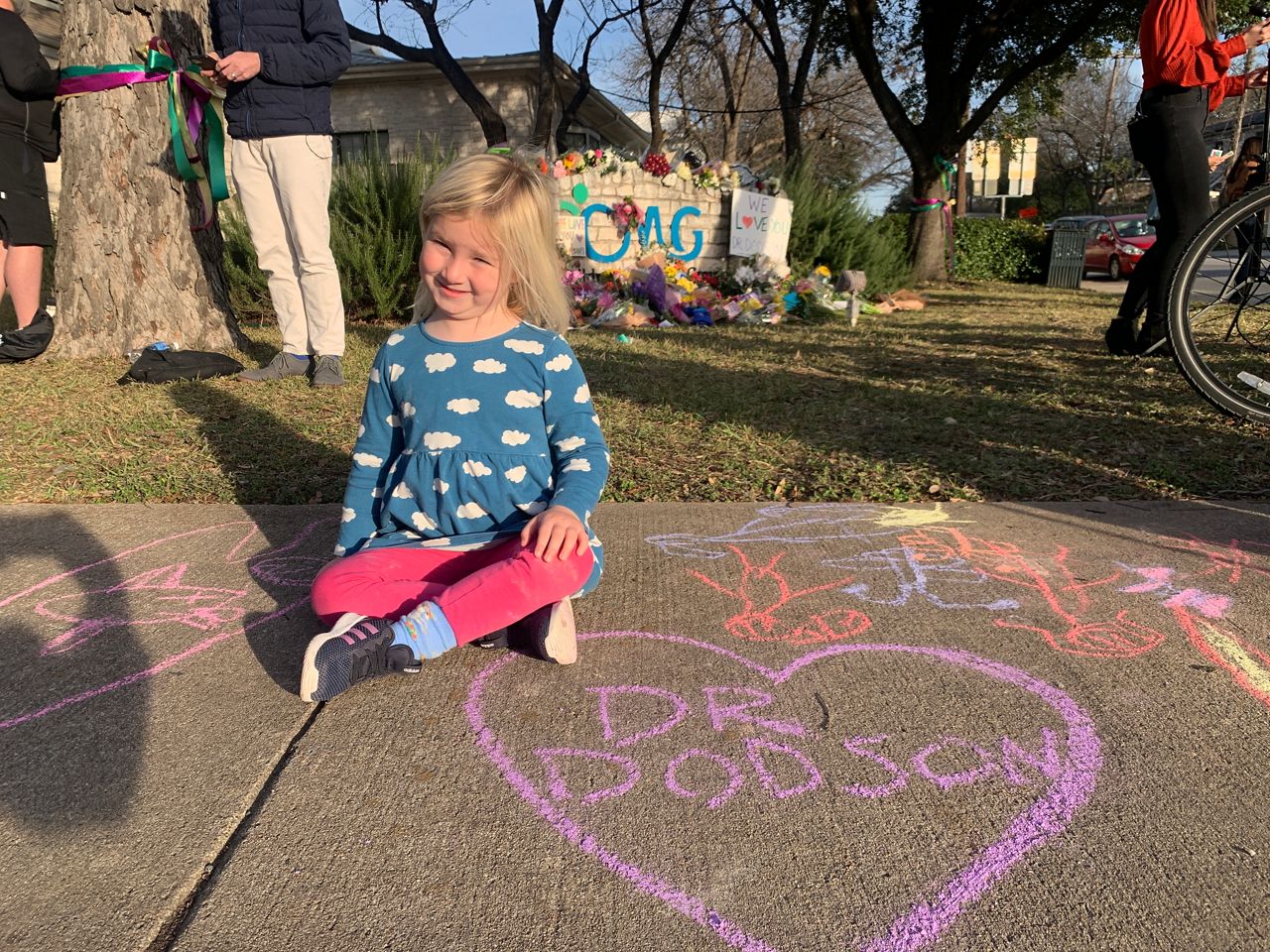 Lulu, a former patient of Dr. Lindley Dodson's, appears at a memorial for the pediatrician in this image from January 27, 2021. (Niki Griswold/Spectrum News 1)