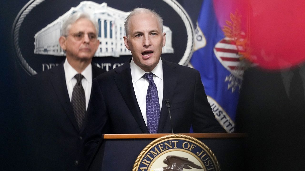 Justice Department's Assistant Attorney General for the National Security Division Matthew Olsen speaks during a news conference at the Department of Justice in Washington, Jan. 27, 2023, as Attorney General Merrick Garland listens at left.  (AP Photo/Carolyn Kaster)