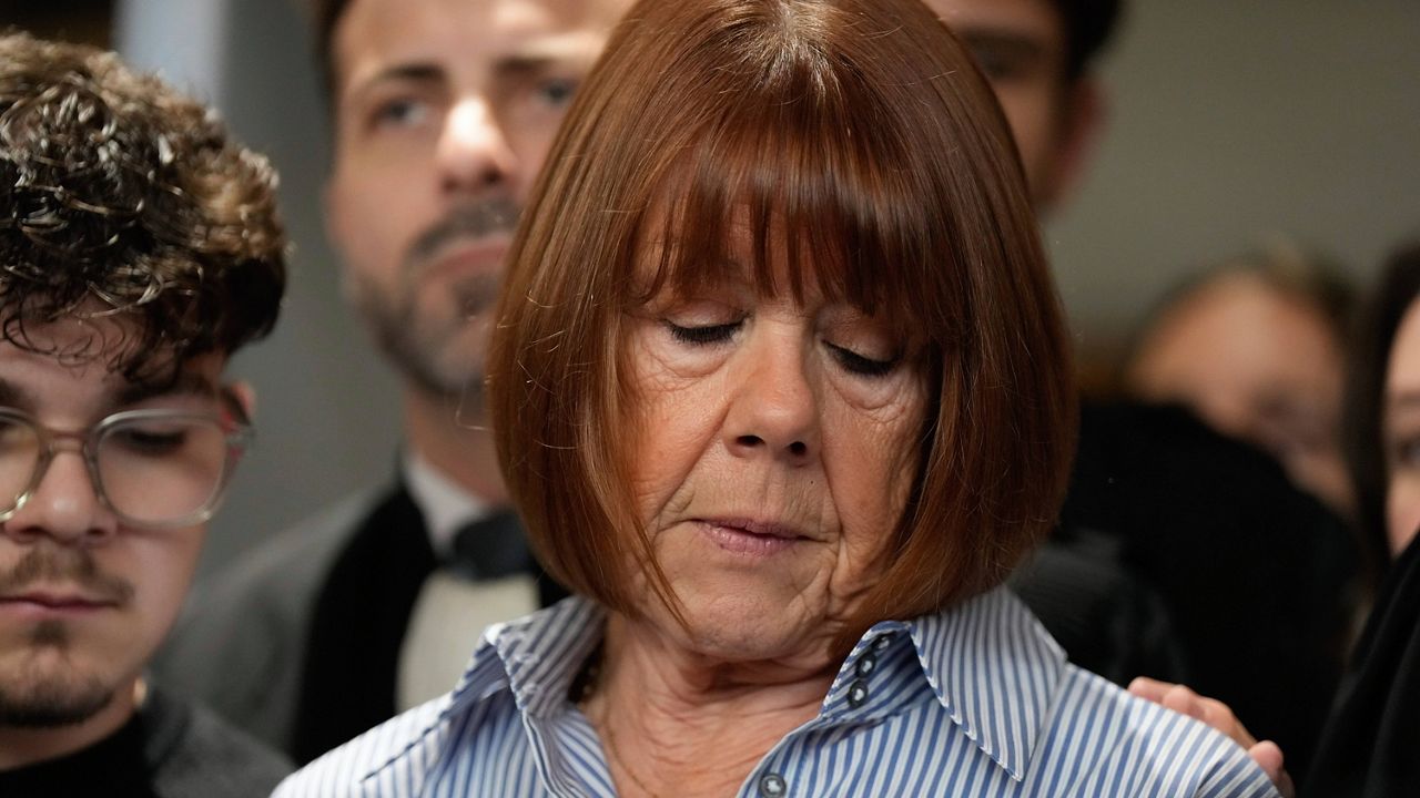 Gisele Pelicot speaks to the press as she leaves the courtroom, in the Avignon courthouse, southern France, Thursday, Dec. 19, 2024. (AP Photo/Lewis Joly)