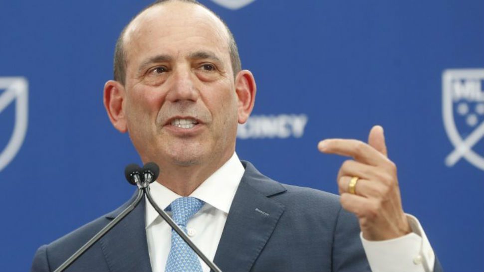 FILE - In this May 29, 2018, file photo, Major League Soccer commissioner Don Garber speaks during an event to announce the addition of FC Cincinnati as an expansion team, in Cincinnati. Major League Soccer is shortening its season by a month, going to single-elimination playoffs and scheduling its 2019 MLS Cup final for Nov. 10 in its earliest finish since 2002. The league announced the change Monday, Dec. 17, 2018, and will have an all-knockout postseason in place of a two-leg format for the conference semifinals and finals. (AP Photo/John Minchillo, File)
