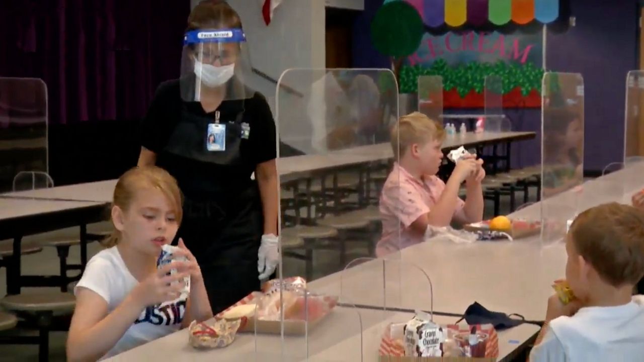 A demonstration from the Pinellas County School District shows plexiglass dividers will be placed at lunch tables when masks cannot be worn while eating. It is one of the many changes for the district, totaling $3 million. (Provided by Pinellas County School District)